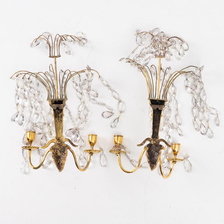 A pair of late Gustavian ormolu two-branch lustres, circa 1800.