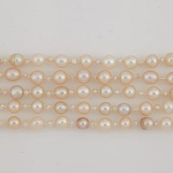 A five strand natural saltwater pearl necklace.