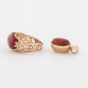 A cabochon cut carnelian ring and brooch.