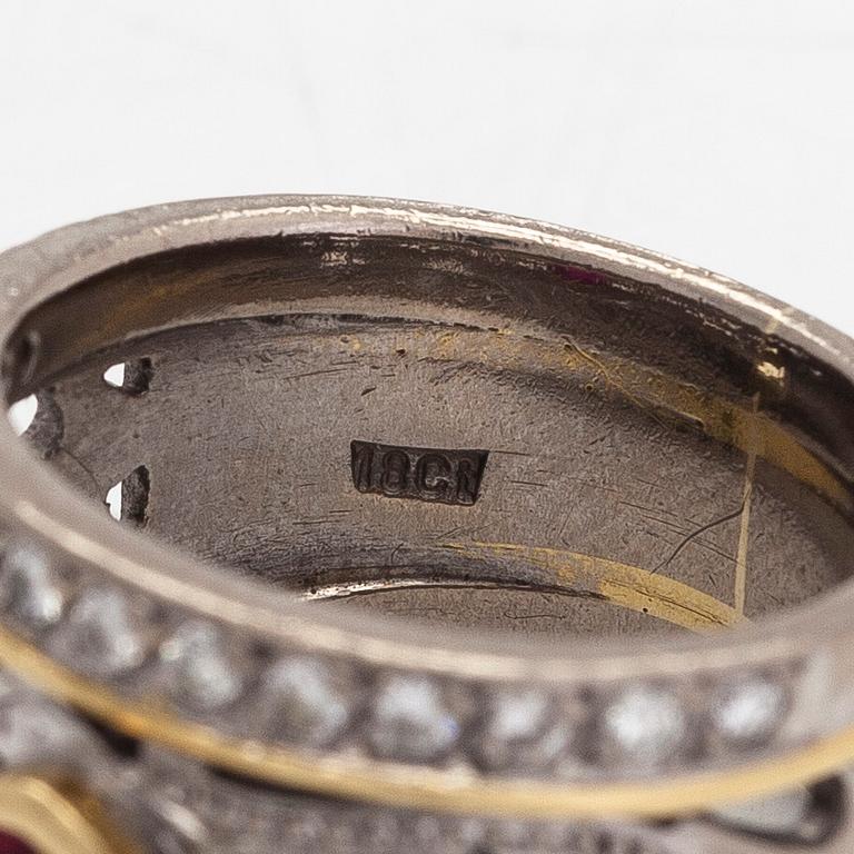 Ring, 18K guld, oval rubin och diamanter totalt ca 0.26 ct.