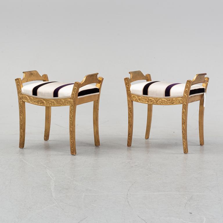 A pair of bronzed stools, 20th Century.