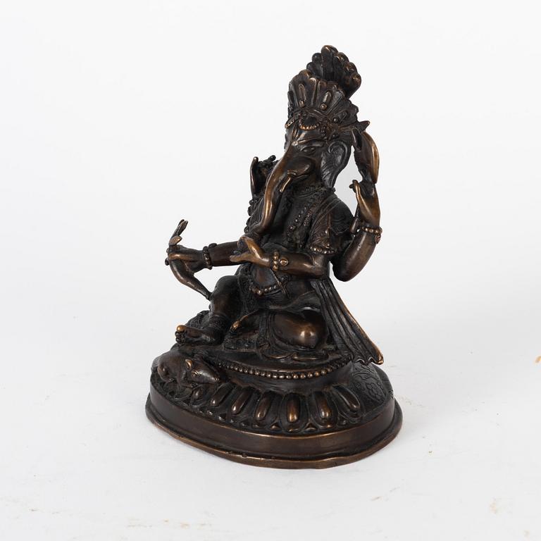 A Nepalese bronze deity, 20th century.