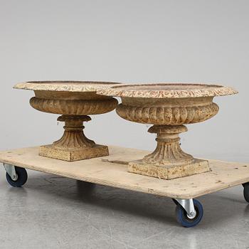 A pair of cast iron plat pots.
