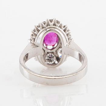 Ring Carmosé 18K white gold with an oval faceted ruby and round brilliant-cut diamonds, Reutners Ystad 1974.