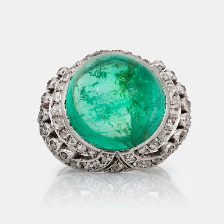 A cabochon-cut emerald and old-cut diamond ring.