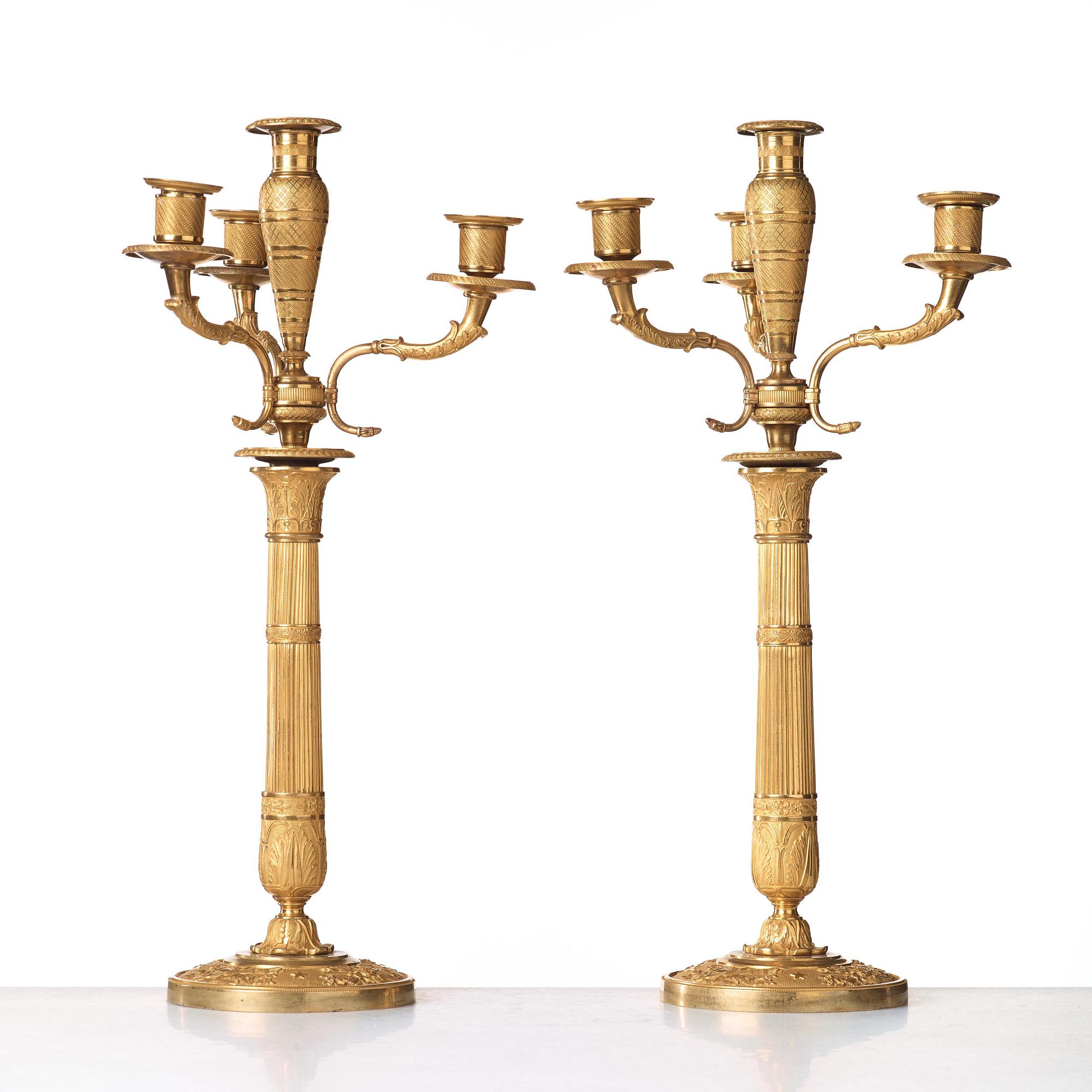 A pair of Empire early 19th century gilt bronze four-light candelabra.