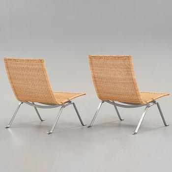 Poul Kjaerholm, a pair of 'PK-22' steel and rattan easy chairs by E Kold Christensen, Denmark.