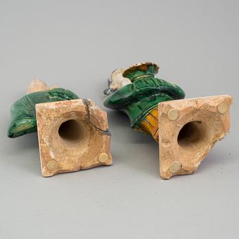 A group of eight chinese figures with three objects, earthenware, Ming dynasty.