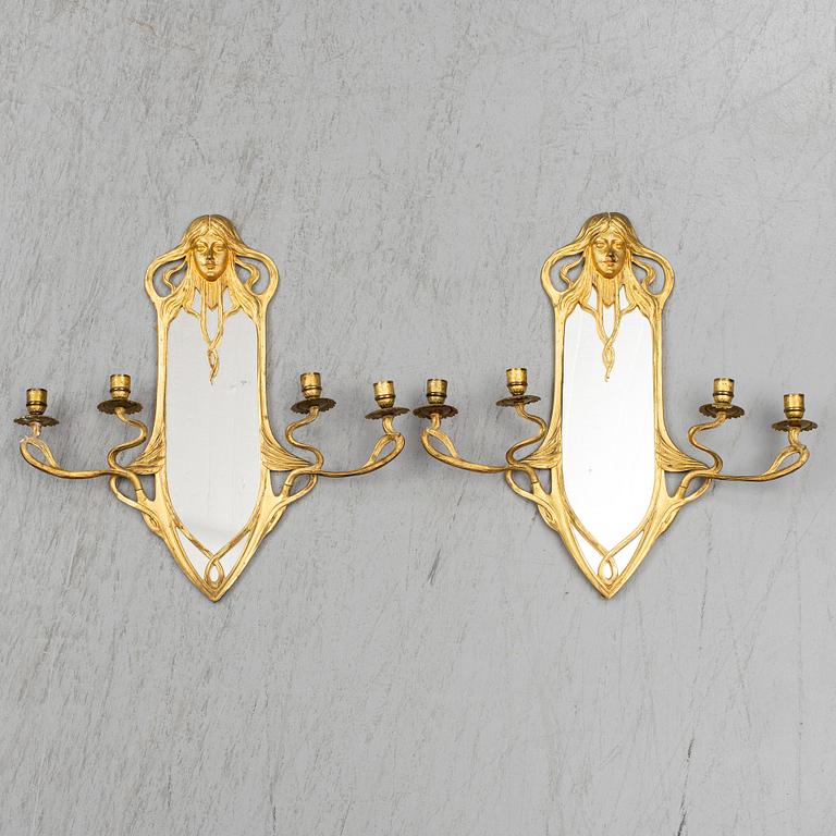 A pair of Art Nouveau mirror wall sconces, easly 20th Century.