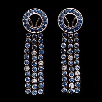 A JEWELLERY SET, 18K white gold, diamonds c. 0.18 ct, sapphires 28.45 ct. K. Saarikorpi 2010. Gold weight 101 g.