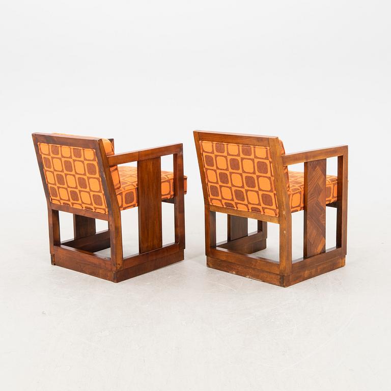 A pair of similar stained wood art déco armchairs from the first half of the 20th century.