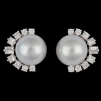 1362. A pair of cultured South sea pearl, 12,5 mm, and diamond earrings.