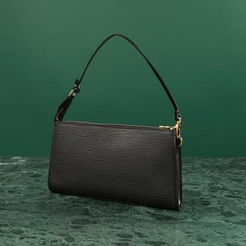 A bag  "Pochette Accessoires" by Louis Vuitton.