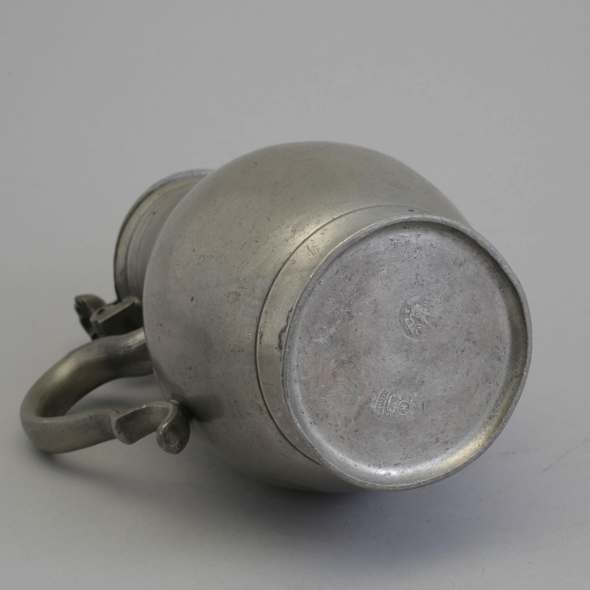A 18th century tin pot.