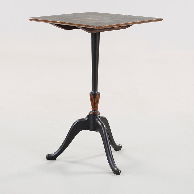 A Swedish tilt top table, from Nils Asplind's workshop, dated 1814.