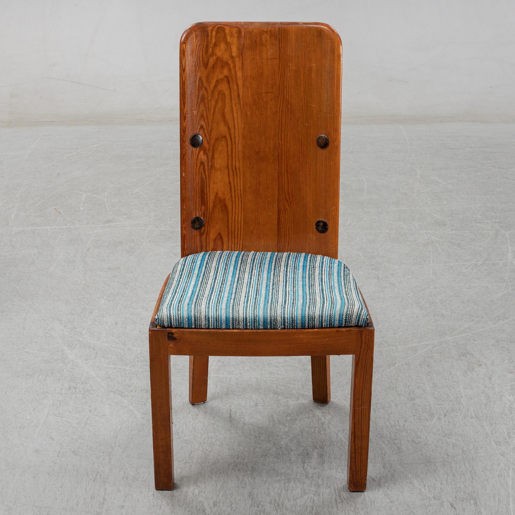 Axel Einar Hjorth, a pair of stained pine "Lovö" chairs, Nordiska Kompaniet, Sweden 1930's.