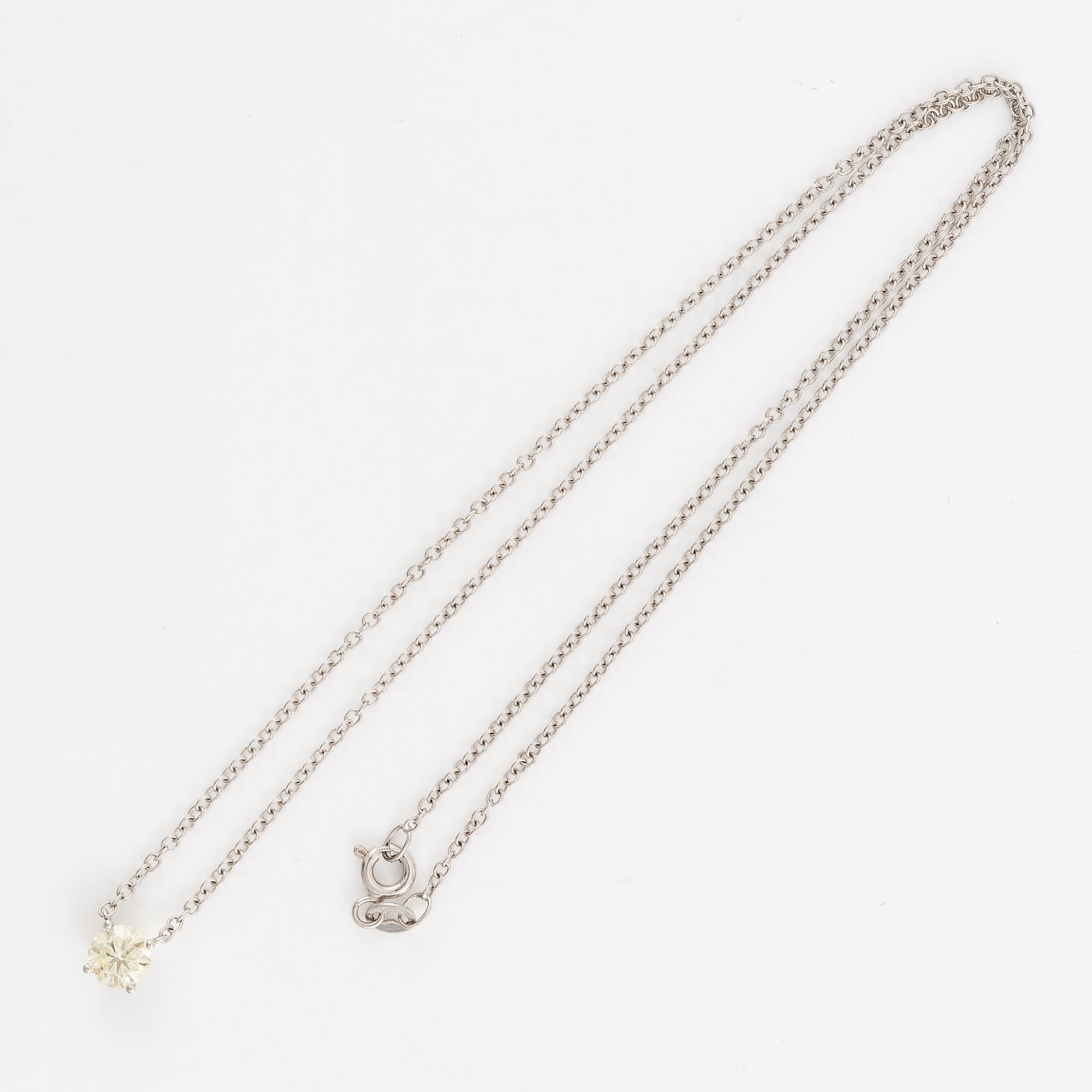 Collier 18K vitguld med briljantslipad diamant.