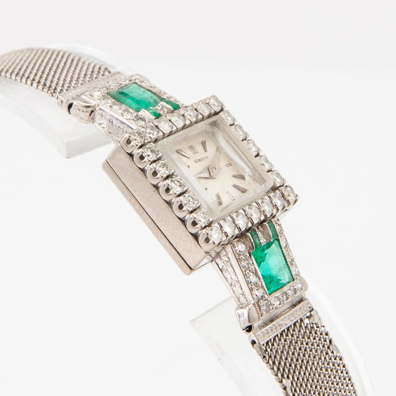 Gübelin bracelet watch in 950 platinum with round brilliant-cut and single-cut diamonds as well as step-cut emeralds.