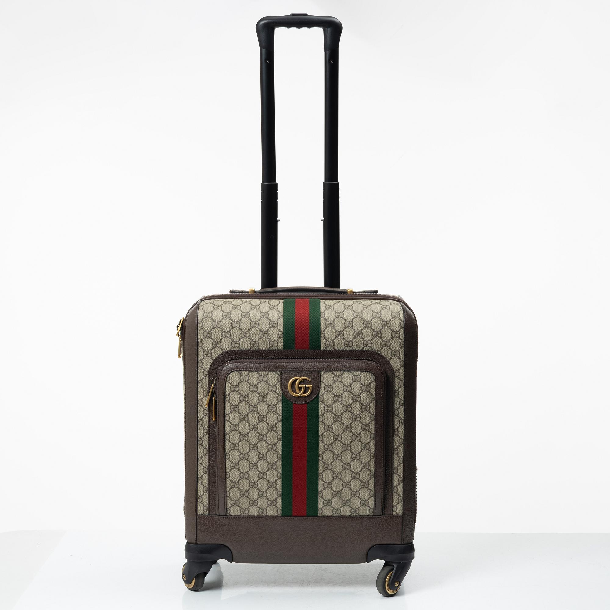 Gucci, suitcase / cabin bag.
