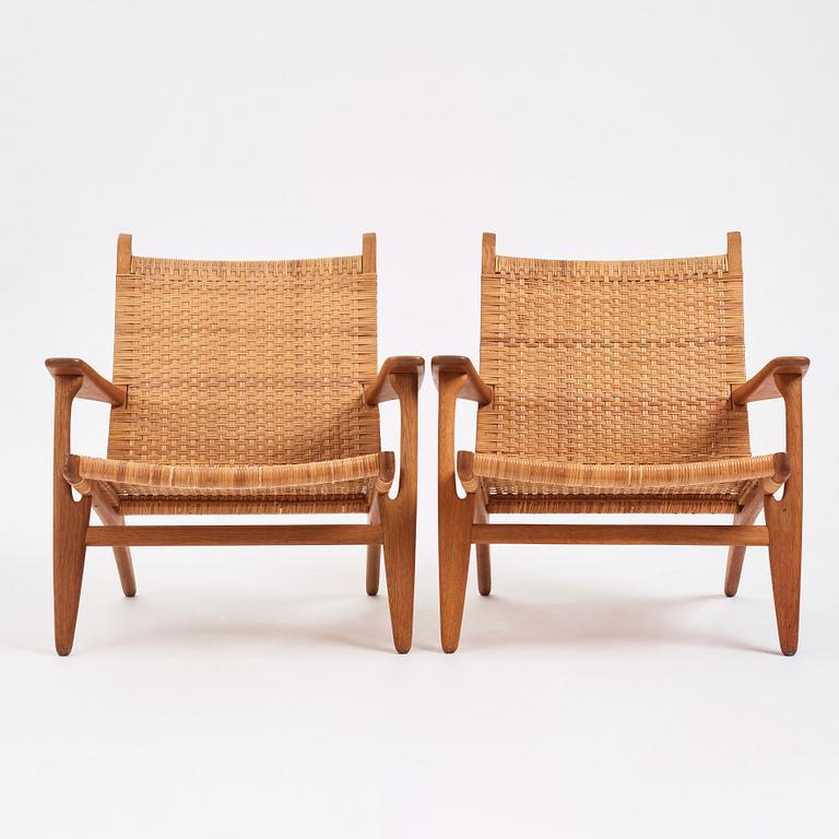 Hans J. Wegner, a pair of oak easy chairs 'CH27', Carl Hansen & Son, Denmark, 1950s.