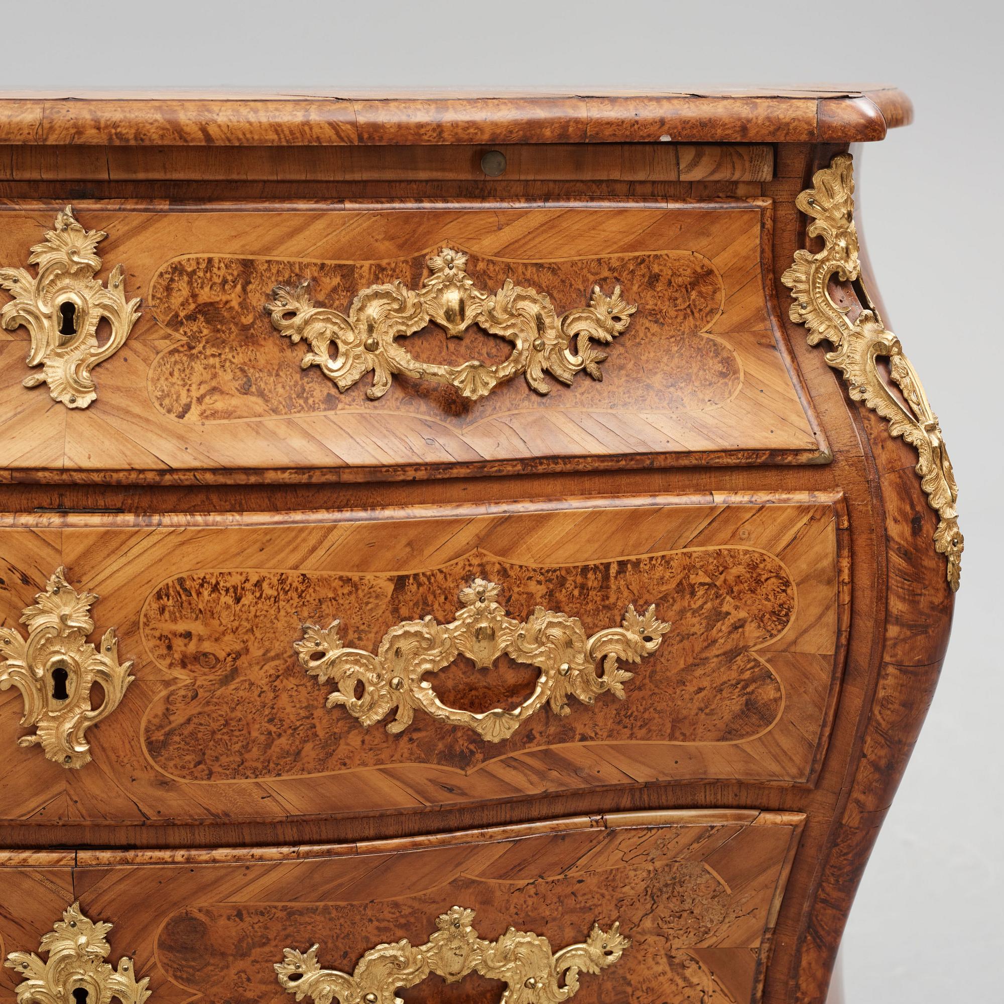A burr-alder and gilt brass-mounted rococo commode by J. Sjölin (master 1767-1785).