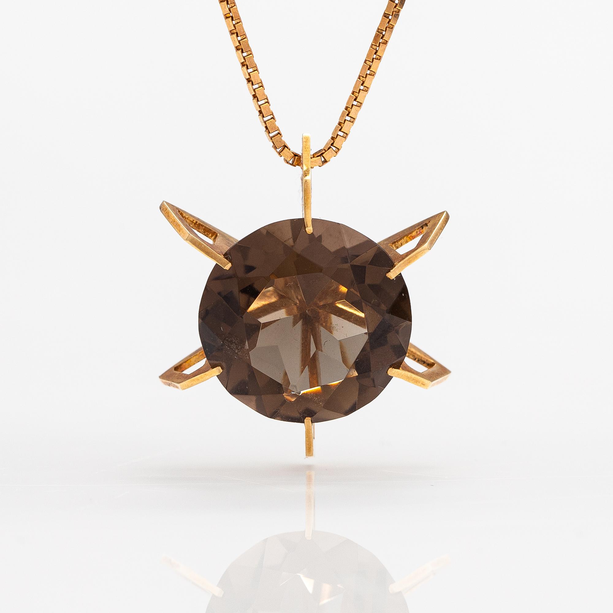 A 14K gold necklace with a smoky quartz. Martti Tapio Aarnio, Helsinki 1966.