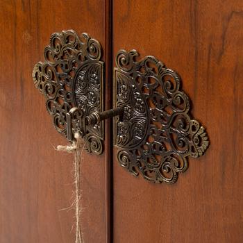 A mid 20th century walnut veneered bar cabinet.