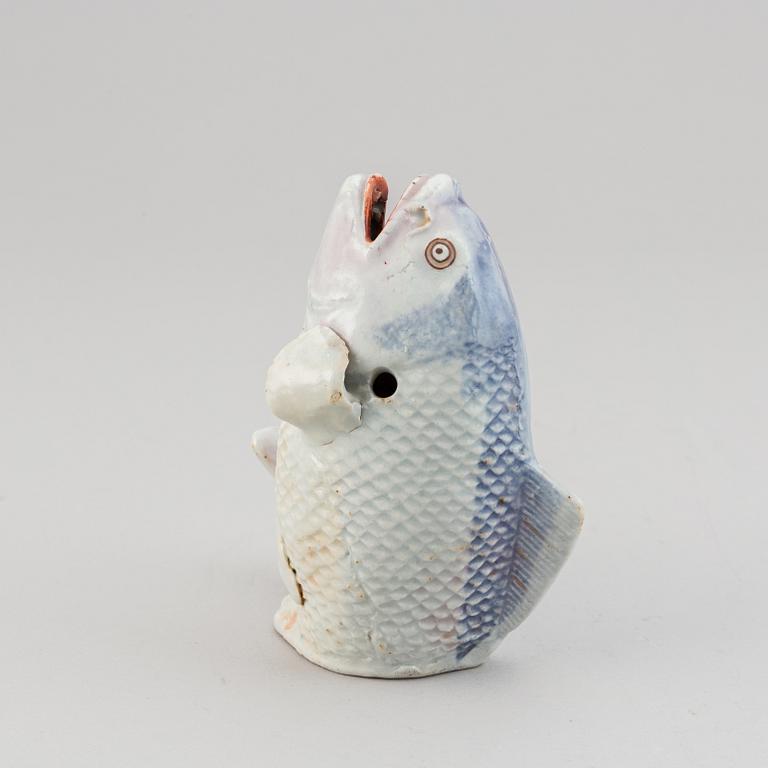 A Japanese porcelain model of a leaping fish, Meiji period (1868-1912).