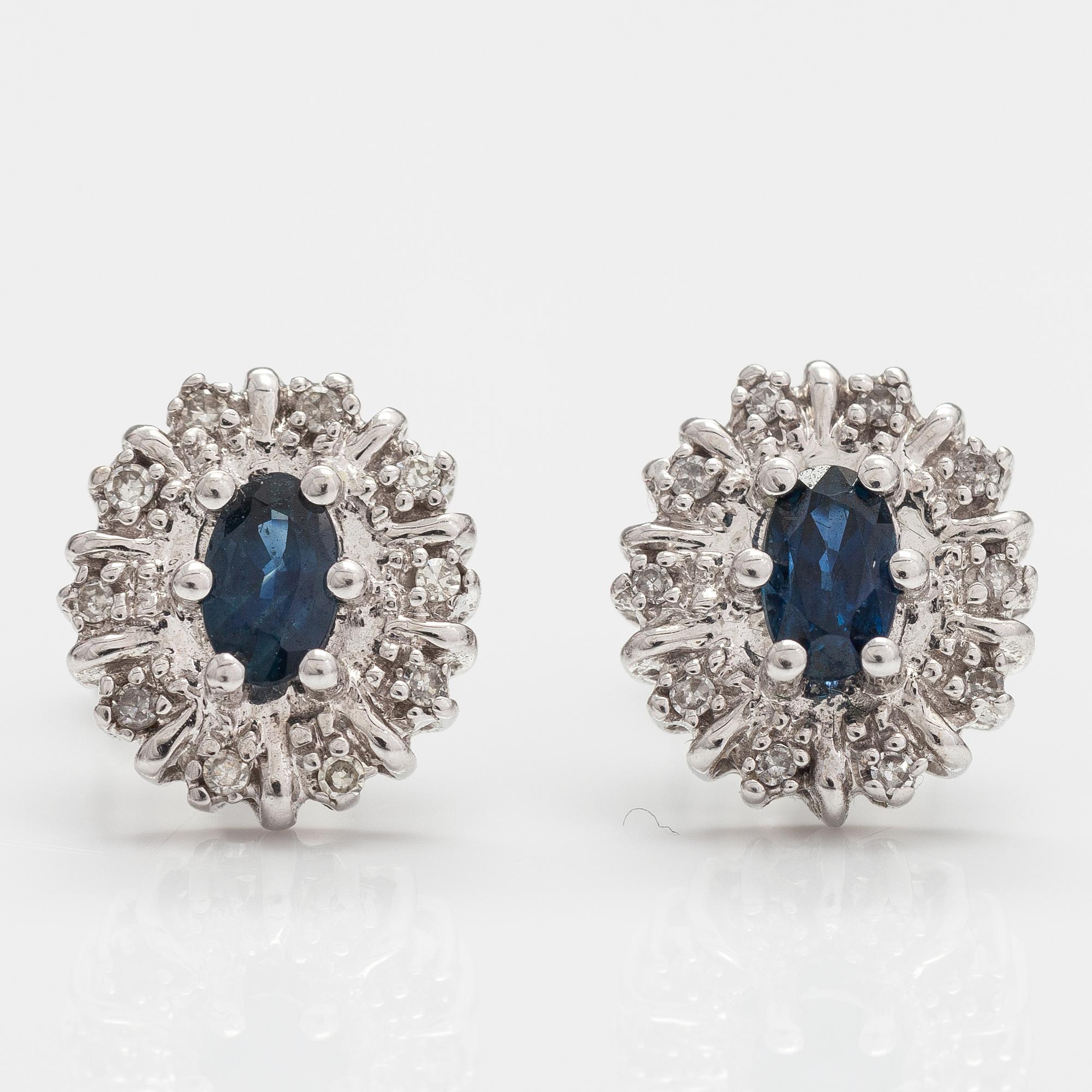 A pair of 14K white gold earrings with sapphires and diamonds ca 0.05 ct in total.
