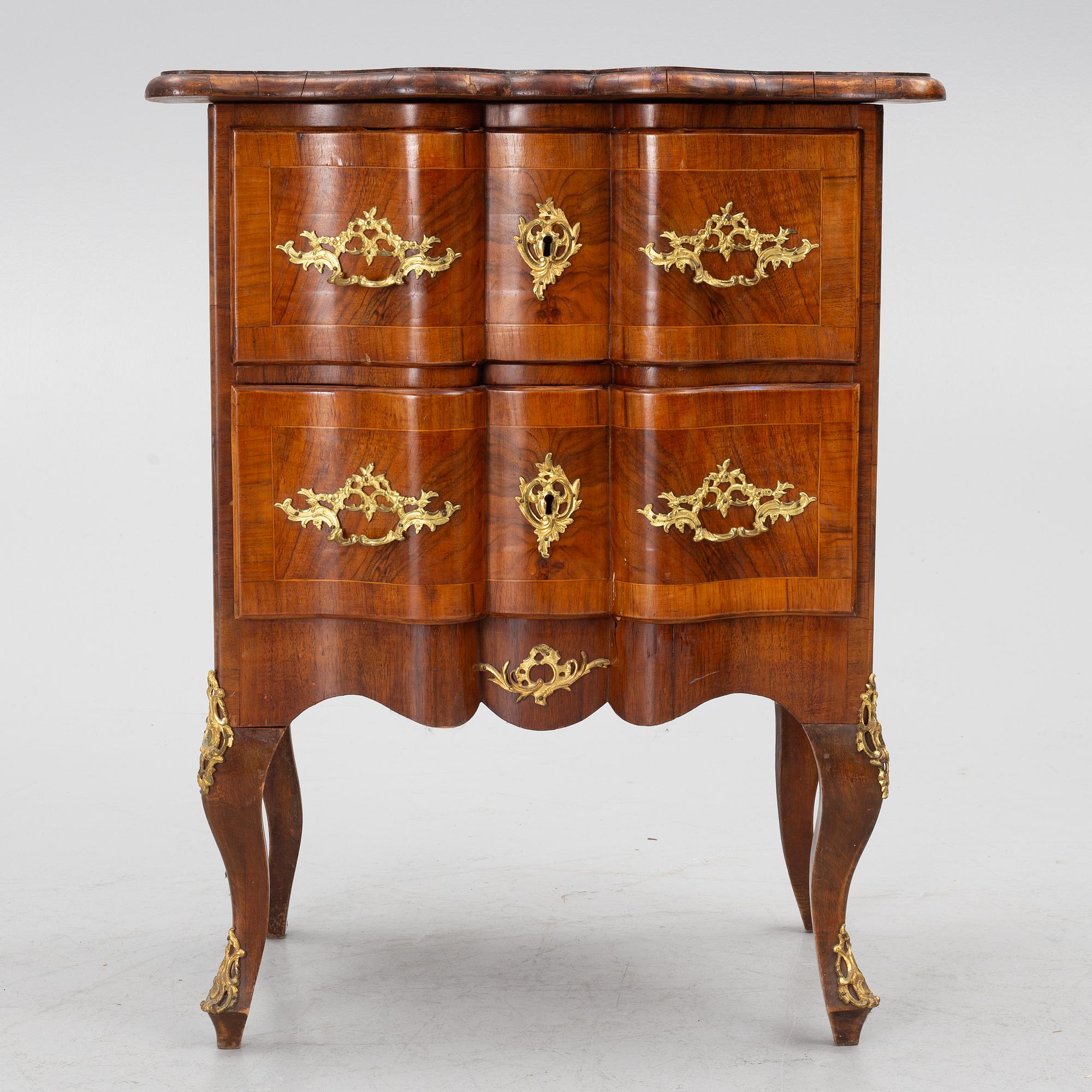A Rococo-style chest of drawers, 19th century.