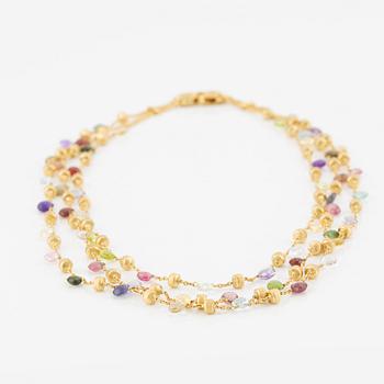 Marco Bicego a three strand necklace in 18K gold with coloured stones.