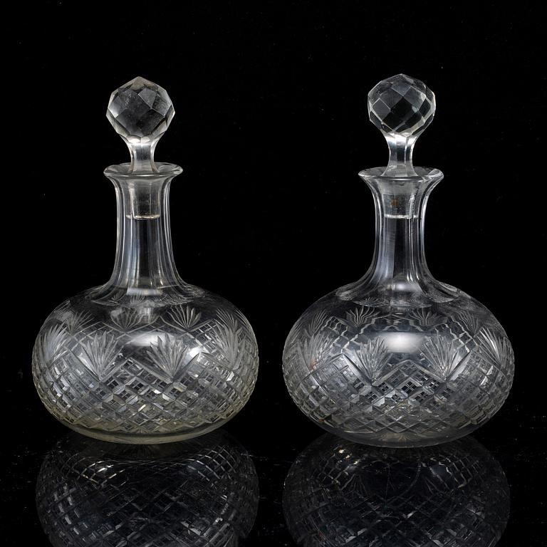 A set of four bottles with stoppers, 20th Century.