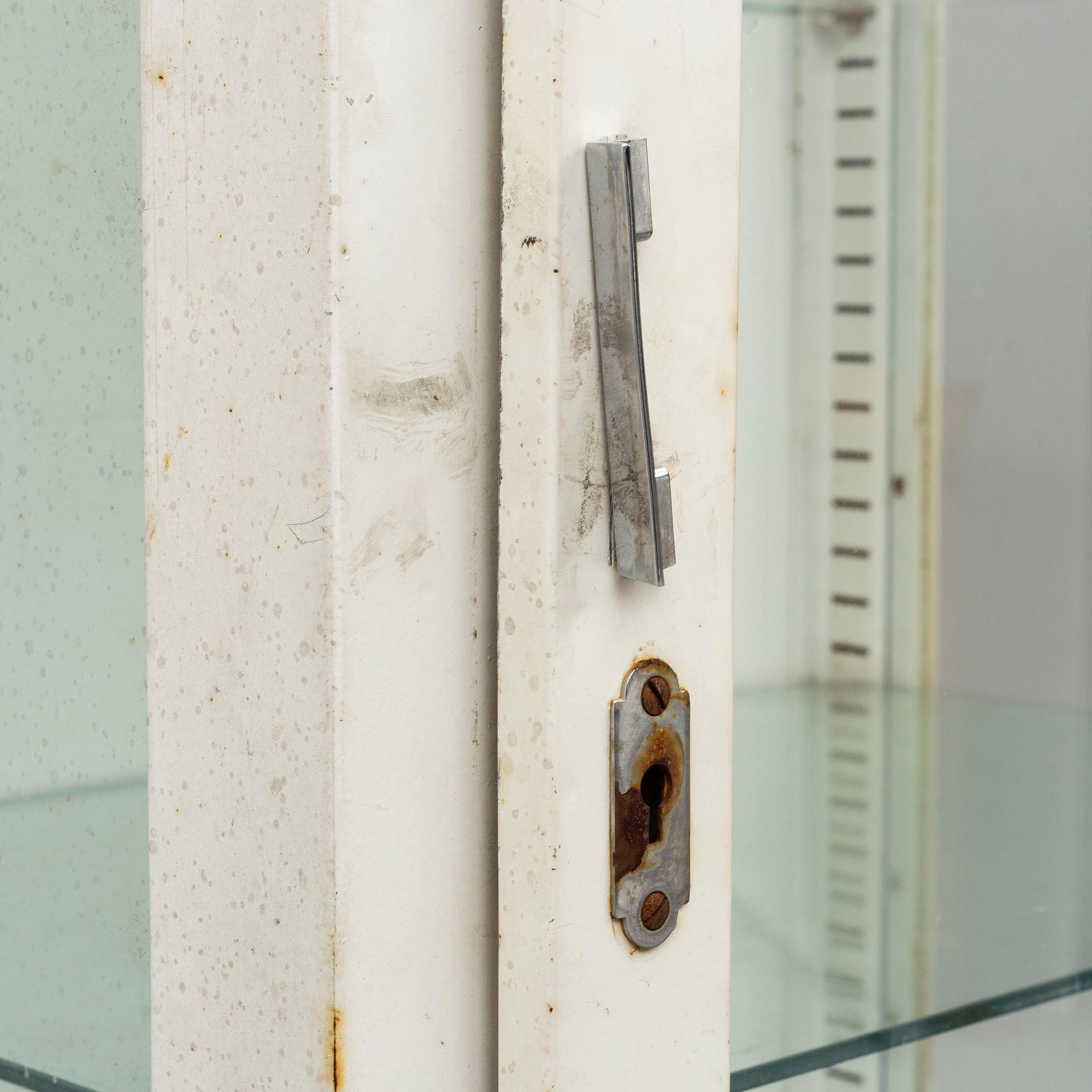 A metal doctor's cabinet, mid 20th century.