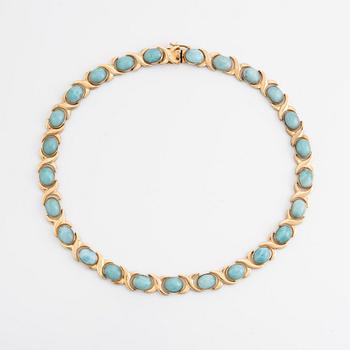 14K gold necklace and ring, with cabochon cut blue stones.