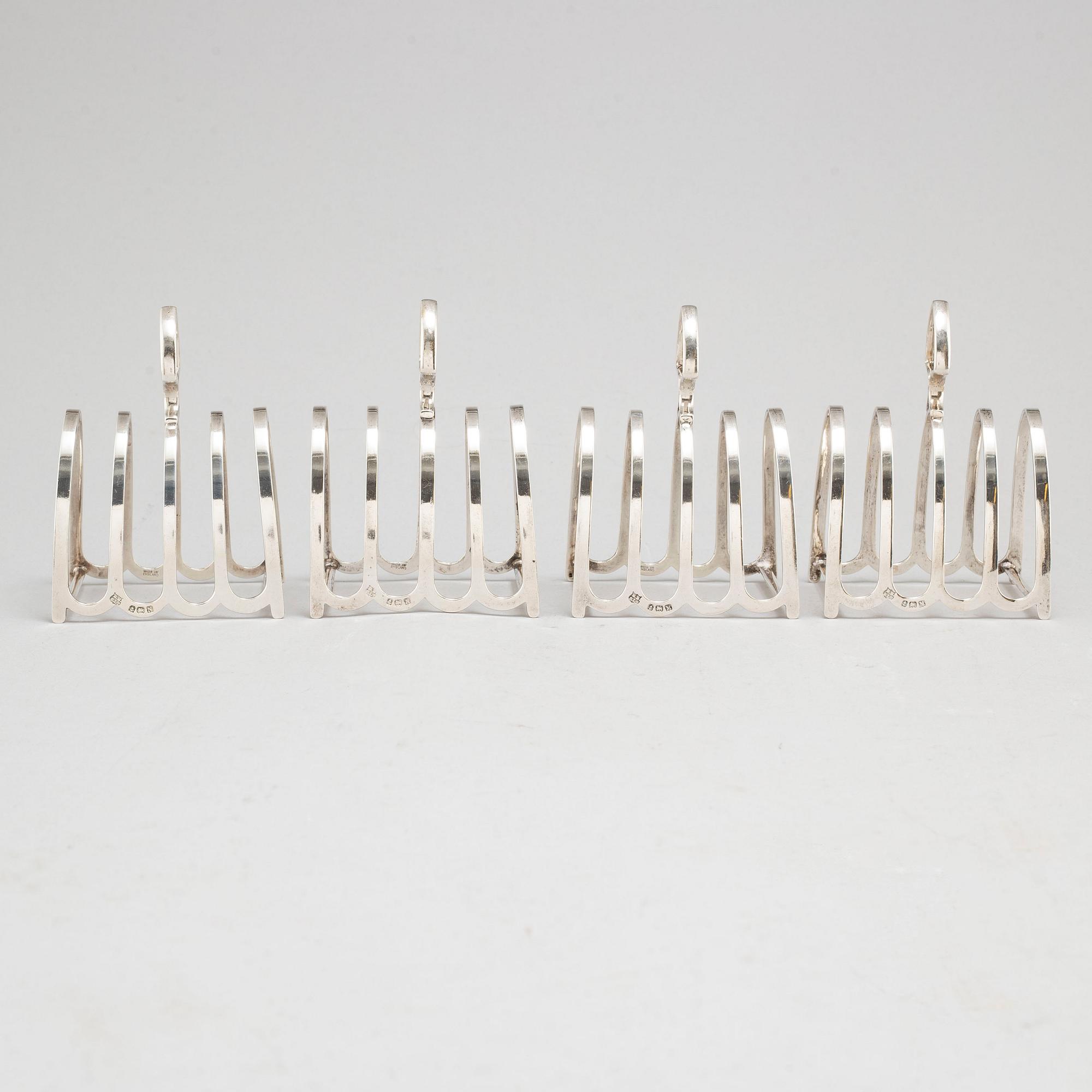 a set of four silver toastracks, Barker Brothers Birmingham 1936.