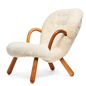 320. Philip Arctander, attributed to, a Clam Chair re-upholstered in white sheepskin, executed or sold by Vik & Blindheim Norway.