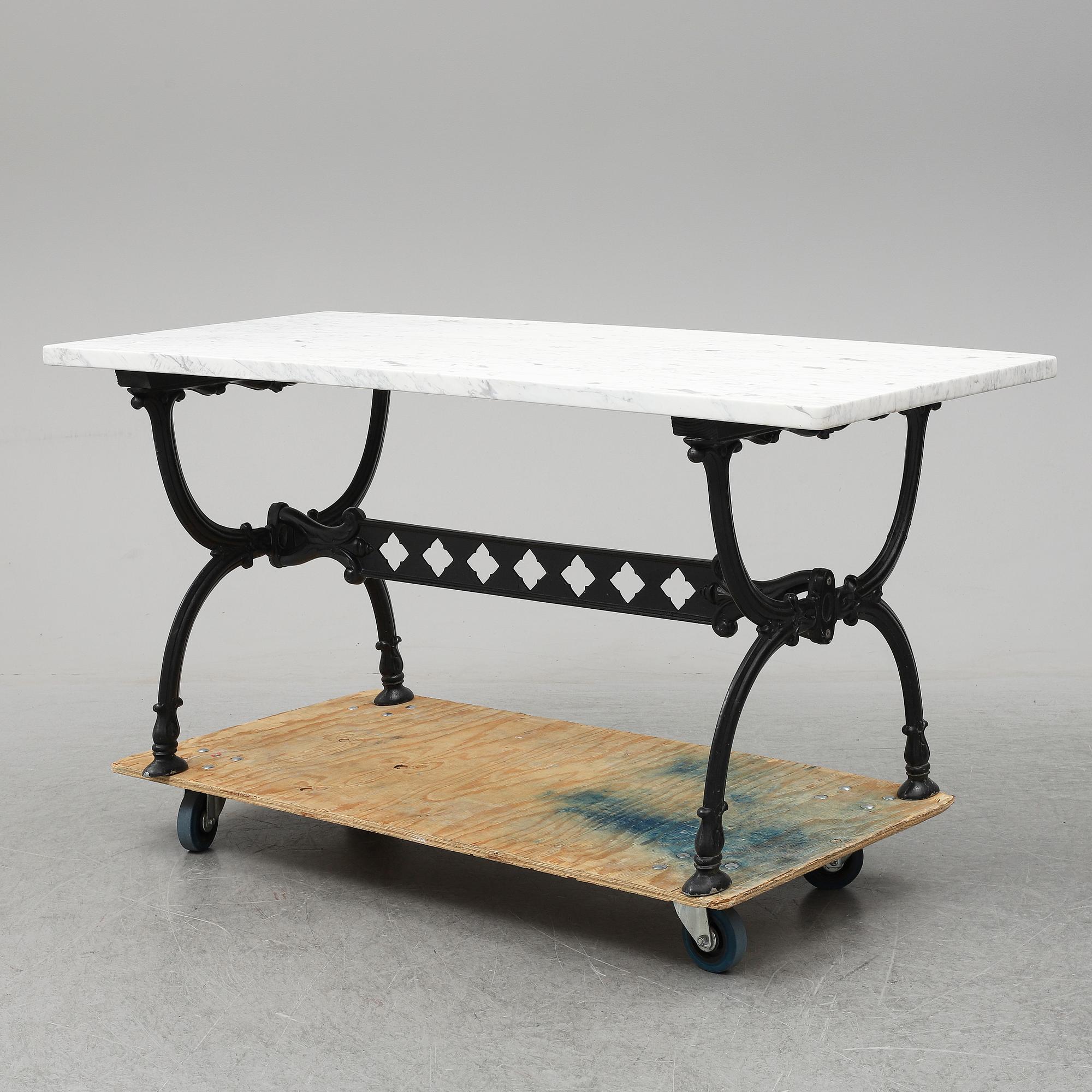 An end of the 20th Century aluminum and marble garden table.