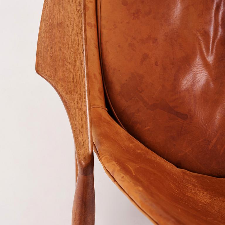 Ib Kofod-Larsen, a pair of teak and cognac coloured leather "Sälen" easy chairs, Olof Perssons Fåtöljindustri (OPE), Sweden, 1950-60's.