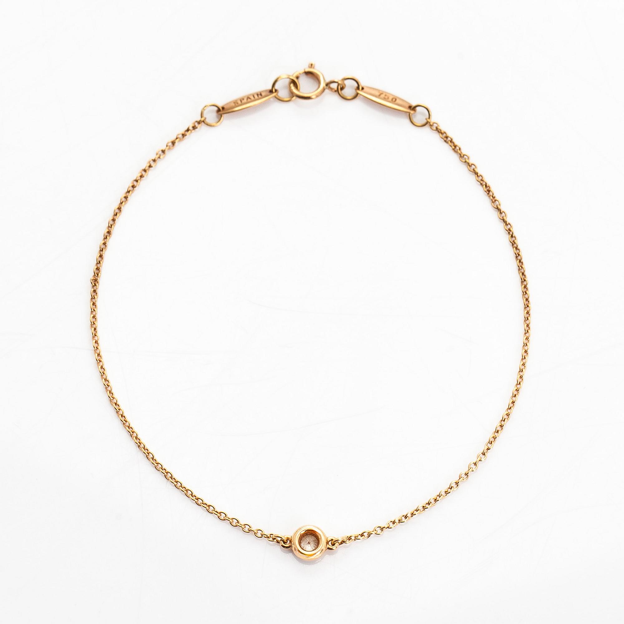 Tiffany & Co, Elsa Peretti, an 18K gold bracelet, 'Diamonds by the Yard', with a diamond approximately 0.08 ct.