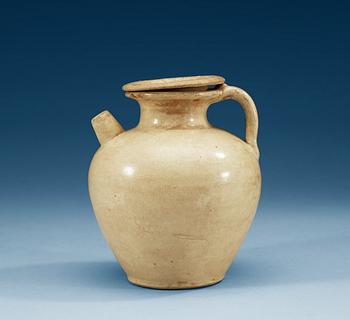 1223. A cream glazed ewer with cover, Tang dynasty (618-907).