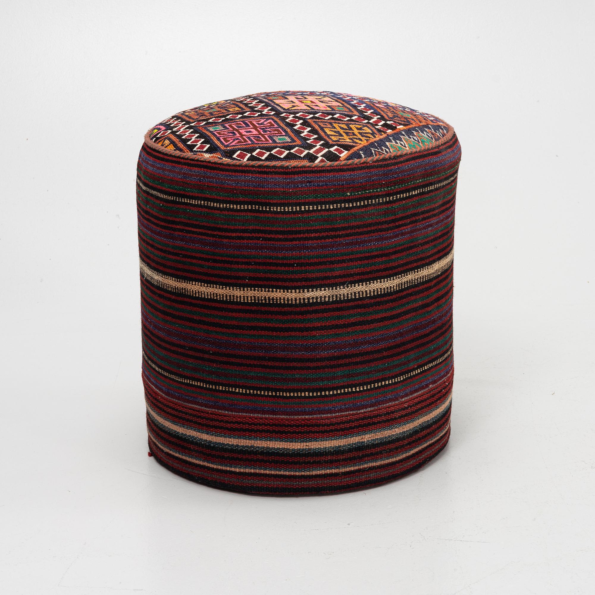 A Kelim covered stool.