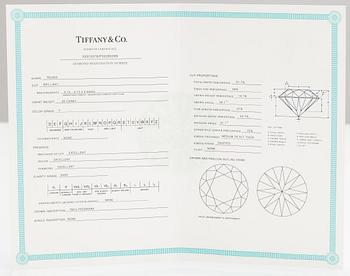 Tiffany & Co, A platinum ring with a ca. 0.26 ct diamond.