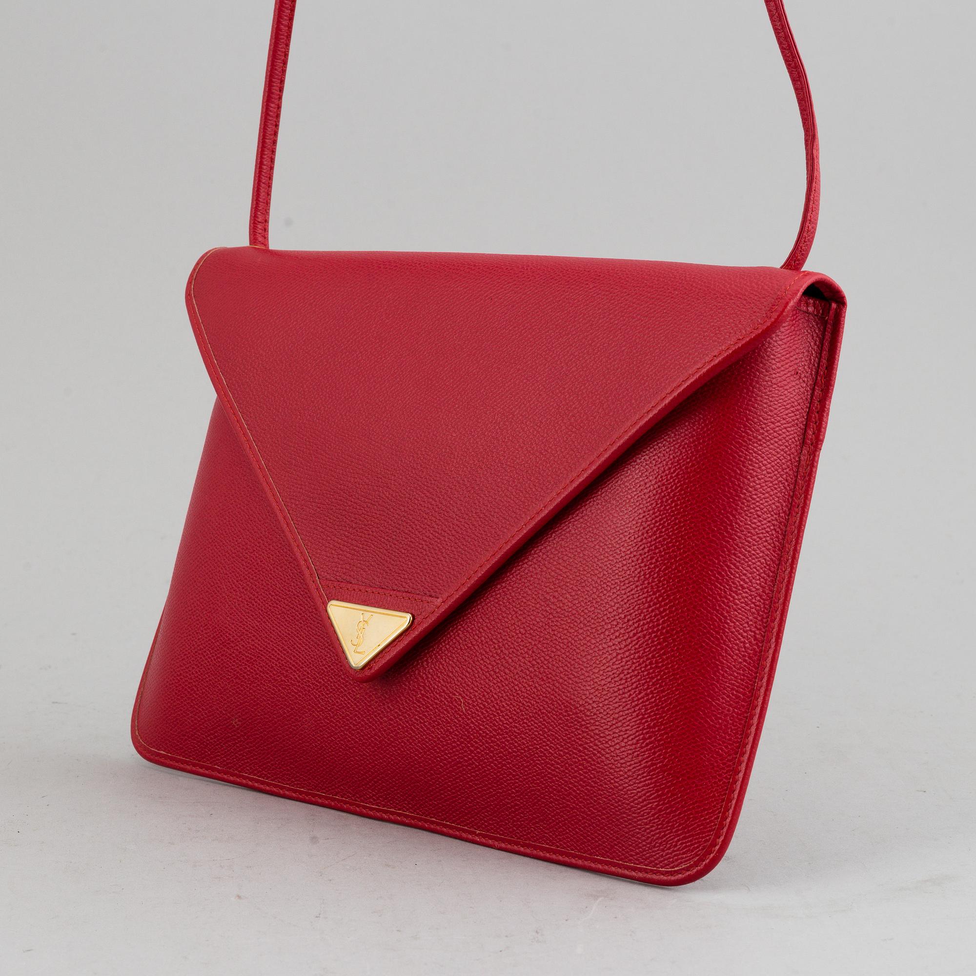 YVES SAINT LAURENT, a red leather bag.