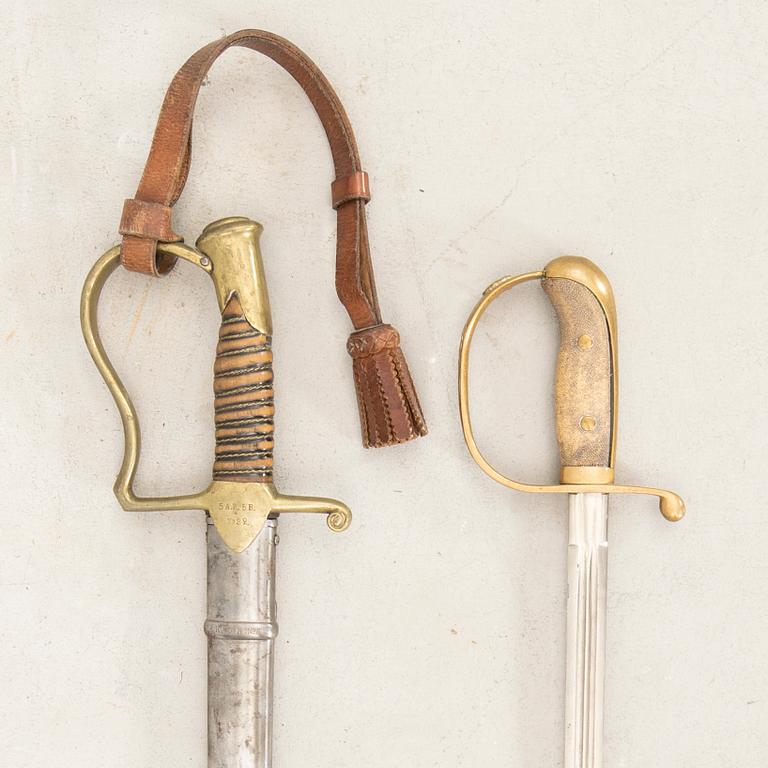 A Swedish sabre 1899 pattern with scabbard with another sword.