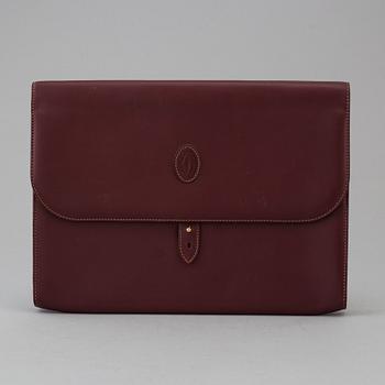 Wine-colored leather briefcase by Cartier.