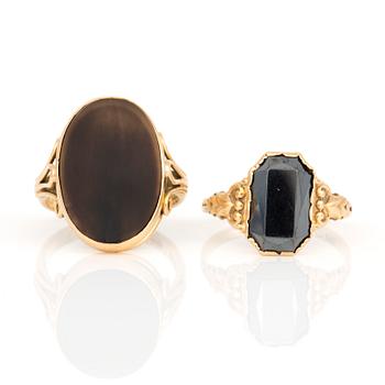 KLACKRINGAR, 2 st, med brun agat och fasetterad hematit, 18K guld.