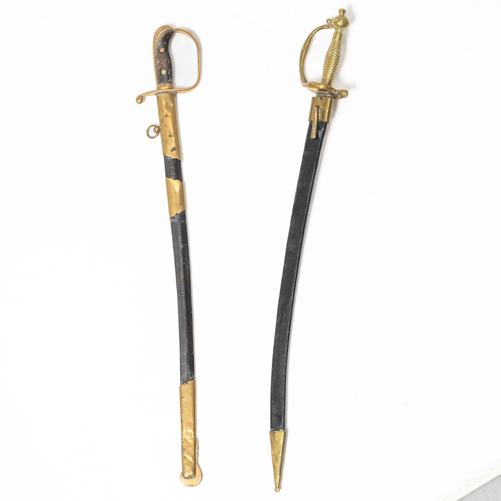 A Swedish police sabre and cutlass, with scabbards.