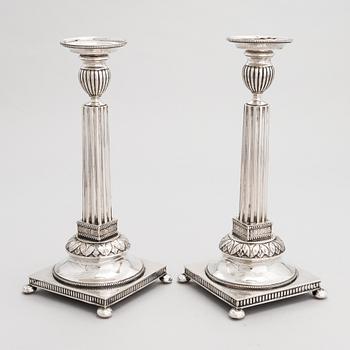 A pair of Swedish silver candlesticks, CG Hallberg, Stockholm 1901 and 1902.