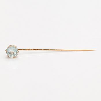 A 14K gold tiepin with a aquamarine.