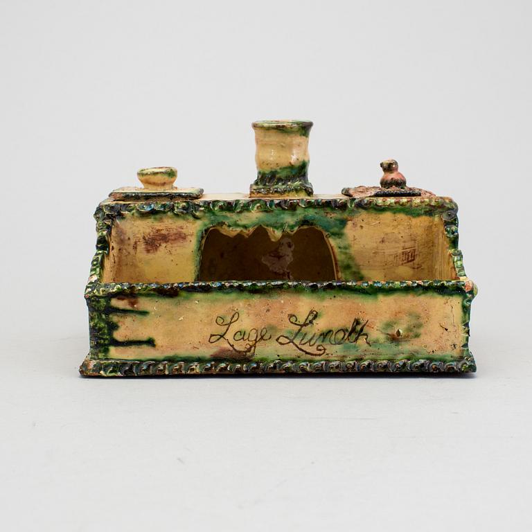 A 19th century pottery ink stand.